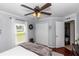 Bright bedroom with a ceiling fan, hardwood floors, and a large closet at 341 Sprucewood Rd, Lake Mary, FL 32746