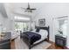Bright bedroom with a ceiling fan, natural light, and access to a patio at 341 Sprucewood Rd, Lake Mary, FL 32746