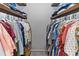Walk-in closet with built-in shelving and plenty of storage space for clothes at 341 Sprucewood Rd, Lake Mary, FL 32746