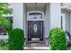 Close up on a home's elegant front door with decorative glass and brick entryway at 341 Sprucewood Rd, Lake Mary, FL 32746