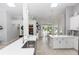 Bright and airy kitchen with white countertops, modern appliances, and a view of the pool and backyard at 341 Sprucewood Rd, Lake Mary, FL 32746