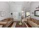 Bright living room with high ceilings, hardwood floors, and natural light from the front door at 341 Sprucewood Rd, Lake Mary, FL 32746
