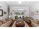 Living room with large sliding glass doors offering views of the pool area at 341 Sprucewood Rd, Lake Mary, FL 32746