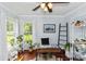 Office space with hardwood floors, natural light, and greenery at 341 Sprucewood Rd, Lake Mary, FL 32746