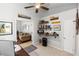 Home office space with bookshelves and open access to living room at 341 Sprucewood Rd, Lake Mary, FL 32746