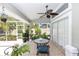 Charming screened-in patio featuring a dining area and lush greenery, creating a serene outdoor retreat at 341 Sprucewood Rd, Lake Mary, FL 32746