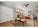 Bright bedroom with ample natural light, a comfortable chair, and a decorative rug, providing a relaxing and airy retreat at 402 S Lake Victoria Cir, Deland, FL 32724