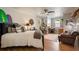 Bedroom with a ceiling fan, surfboard wall art, and space for an office setup at 402 S Lake Victoria Cir, Deland, FL 32724