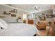 Well-lit bedroom features decorative shelving, a comfortable chair, and ample storage, creating a cozy and organized living space at 402 S Lake Victoria Cir, Deland, FL 32724