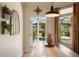 A dining area that features a view of the pool area and lots of natural light from the windows at 402 S Lake Victoria Cir, Deland, FL 32724