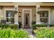Welcoming entryway with a bright, open door and lush landscaping at 402 S Lake Victoria Cir, Deland, FL 32724