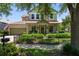 Charming two-story home featuring a landscaped front yard and inviting front porch at 402 S Lake Victoria Cir, Deland, FL 32724