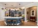 Bright kitchen boasts a large island with quartz countertops, stainless appliances, and pendant lighting at 402 S Lake Victoria Cir, Deland, FL 32724
