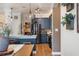 Open kitchen with stainless appliances, quartz countertops, custom cabinetry, and seamless flow to the dining area at 402 S Lake Victoria Cir, Deland, FL 32724