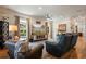 Living room with entertainment center, seating, rug and ceiling fan at 402 S Lake Victoria Cir, Deland, FL 32724