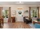 Inviting living room features wood floors, a decorative wreath on the front door, and neutral-toned decor at 402 S Lake Victoria Cir, Deland, FL 32724