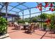 Relaxing covered patio with comfortable seating, providing a cozy outdoor space for entertaining or enjoying the serene surroundings at 402 S Lake Victoria Cir, Deland, FL 32724