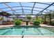 Covered pool area with a seating area and bar perfect for outdoor entertaining at 402 S Lake Victoria Cir, Deland, FL 32724