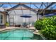 A tranquil pool area featuring comfortable lounge chairs, creating a perfect spot for relaxation and enjoying the serene ambiance at 402 S Lake Victoria Cir, Deland, FL 32724