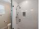 Bright shower with subway tile, a mosaic shower niche, and a glass door at 402 S Lake Victoria Cir, Deland, FL 32724