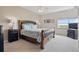 Comfortable bedroom featuring a large bed, bedside tables, lamps, and a window with a scenic view at 5300 S Atlantic Ave # 6-507, New Smyrna Beach, FL 32169