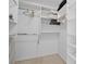 Walk-in closet featuring custom shelves and hanging racks for ample storage at 5300 S Atlantic Ave # 6-507, New Smyrna Beach, FL 32169