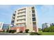 Multi-story building featuring balconies and a combination of stucco and coral brick at 5300 S Atlantic Ave # 6-507, New Smyrna Beach, FL 32169