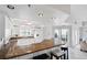 Spacious kitchen featuring granite counters, ample cabinet space, and modern appliances with seamless flow to living area at 5300 S Atlantic Ave # 6-507, New Smyrna Beach, FL 32169