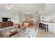 Spacious living area with tile floors, comfortable seating, and open access to kitchen at 5300 S Atlantic Ave # 6-507, New Smyrna Beach, FL 32169