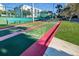 Close up of a shuffleboard court with condo buildings in the background at 5300 S Atlantic Ave # 6-507, New Smyrna Beach, FL 32169