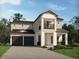 Charming two-story home with a covered front porch and a two-car garage at 5320 Citrus Leaf Blvd, Winter Garden, FL 34787
