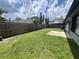 This large backyard features a wood fence and a concrete patio at 549 Silvergate Loop, Lake Mary, FL 32746