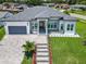 An aerial view of the home, highlighting the manicured lawn, landscaping, and proximity to neighboring houses at 601 Green Briar Blvd, Altamonte Springs, FL 32714