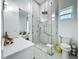Luxurious bathroom features a glass enclosed shower, white marble floors, and modern fixtures at 601 Green Briar Blvd, Altamonte Springs, FL 32714