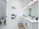 Open bathroom layout with double vanity, sleek fixtures, and access to the bedroom at 601 Green Briar Blvd, Altamonte Springs, FL 32714