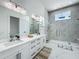 Beautiful bathroom features a glass shower enclosure, white marble counters and double sinks at 601 Green Briar Blvd, Altamonte Springs, FL 32714