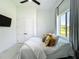 Cozy bedroom with a comfortable bed, stylish pillows, and large window view at 601 Green Briar Blvd, Altamonte Springs, FL 32714