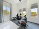 Home gym with workout equipment, large windows and bright light providing an ideal fitness space at 601 Green Briar Blvd, Altamonte Springs, FL 32714