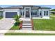 Beautiful home showcasing a landscaped front yard and decorative walkway leading to the front door at 601 Green Briar Blvd, Altamonte Springs, FL 32714