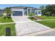 Attractive front yard with manicured lawn, patterned driveway, and decorative landscaping at 601 Green Briar Blvd, Altamonte Springs, FL 32714