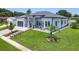 Charming home featuring a well-kept lawn, decorative landscaping, and a view of the side yard at 601 Green Briar Blvd, Altamonte Springs, FL 32714
