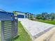 A wide shot of the modern home showcasing the driveway and front yard at 601 Green Briar Blvd, Altamonte Springs, FL 32714