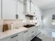 Gourmet kitchen featuring white cabinetry, quartz countertops, stainless steel appliances, and modern finishes at 601 Green Briar Blvd, Altamonte Springs, FL 32714