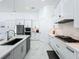 Well-appointed kitchen featuring white cabinets, stainless steel appliances, and a functional layout for cooking and entertaining at 601 Green Briar Blvd, Altamonte Springs, FL 32714