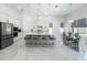 Spacious, modern kitchen with a large island, pendant lighting, stainless steel appliances, and a connected dining area at 601 Green Briar Blvd, Altamonte Springs, FL 32714