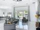 Bright living room with stylish sofas, large windows offering a view of the pool, and open layout at 601 Green Briar Blvd, Altamonte Springs, FL 32714