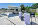 Outdoor space features a covered entertainment area, with views of the pool and backyard, perfect for gatherings at 601 Green Briar Blvd, Altamonte Springs, FL 32714