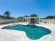 Beautiful backyard oasis featuring a custom pool with a sun shelf, waterfall feature, and a covered outdoor entertainment area at 601 Green Briar Blvd, Altamonte Springs, FL 32714