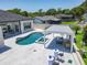 Aerial view of the backyard pool with hot tub, outdoor kitchen, and patio seating at 601 Green Briar Blvd, Altamonte Springs, FL 32714