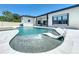Enjoy the pool view of the home's exterior, seamlessly blending indoor/outdoor living with sun shelf and water feature at 601 Green Briar Blvd, Altamonte Springs, FL 32714
